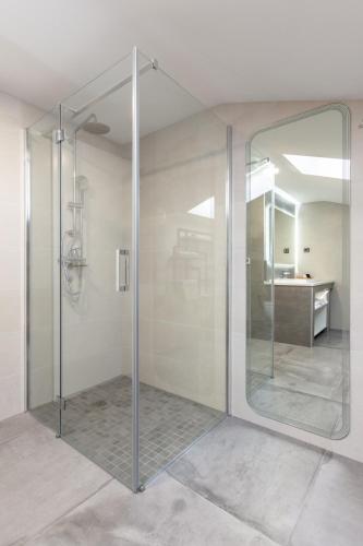 a glass shower in a bathroom with a sink at Pampas apartments Mrežnica in Duga Resa