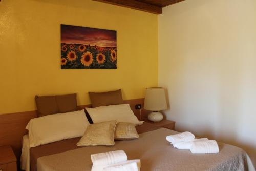 Postel nebo postele na pokoji v ubytování B&B La Vigna