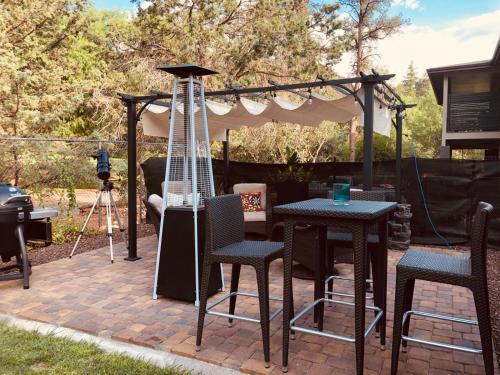 a patio with a gazebo and tables and chairs at Sedona Red Rock Garden of Paradise Pets friendly and Hot tub in Sedona