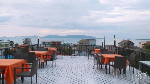 a row of tables and chairs on top of a building at The Villager Fishermans Village in Bophut