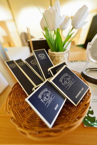 a bunch of cards sitting on top of a basket at Nacpan Beach Glamping Managed by H Hospitality Group in El Nido