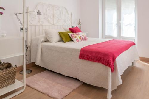 Een bed of bedden in een kamer bij La Fontina de Luarca
