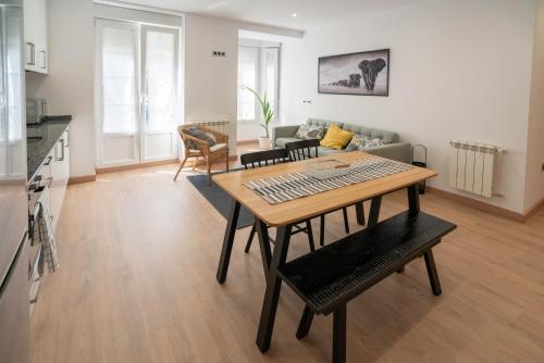 a living room with a table with a keyboard on it at La Fontina de Luarca in Luarca