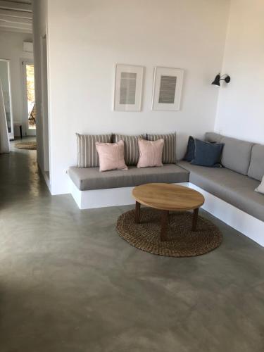a living room with a couch and a coffee table at Theros apartments 2 in Mylopotas