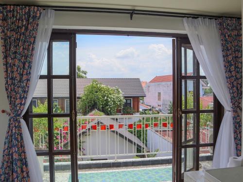 a window with a view of a balcony at Homestay in Tay Ninh in Tây Ninh