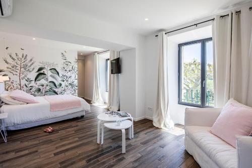 Säng eller sängar i ett rum på Maison Galatéa