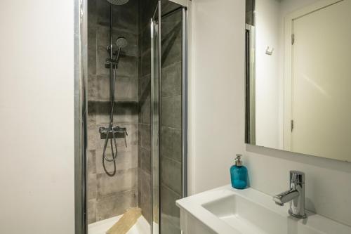 a bathroom with a shower and a sink at New Bluebell house in heart of Porto in Porto