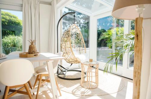 a room with a table and chairs and a window at Luxury villa on peaceful location. Boat optional in Vinkeveen