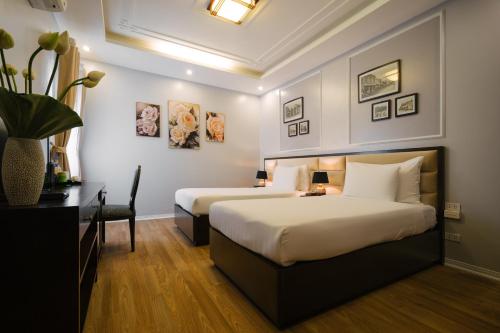 Postel nebo postele na pokoji v ubytování La Palm Hotel