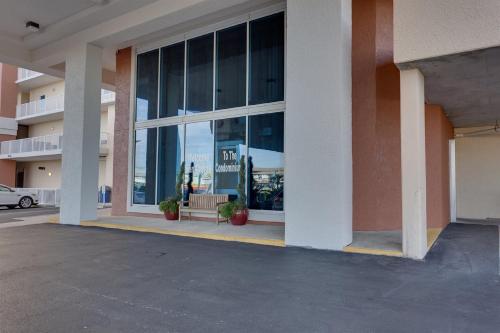a building with a bench in front of a window at San Carlos Unit 607 in Gulf Shores