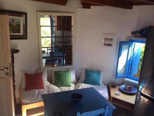 a living room with a couch and a table at Villa Antonia in Almirida