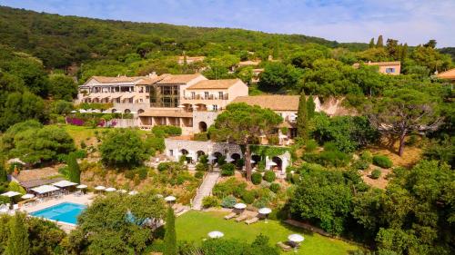 an aerial view of a estate with a swimming pool at Hostellerie Le Baou in Ramatuelle