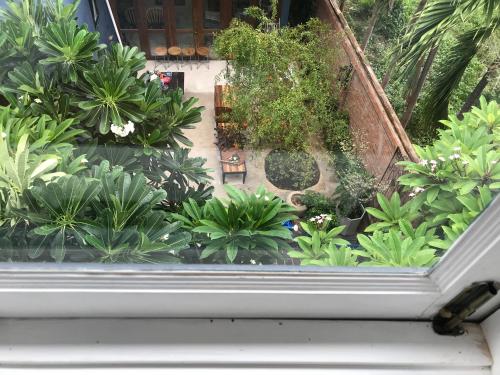 an overhead view of a garden from a window at P.O.E Posh Homestay in Cha Am
