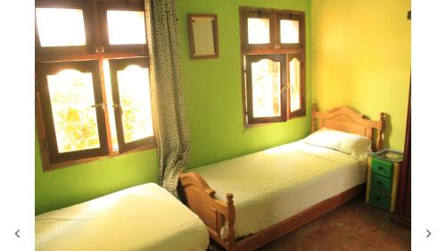 Una cama o camas en una habitación de Harmony Hotel