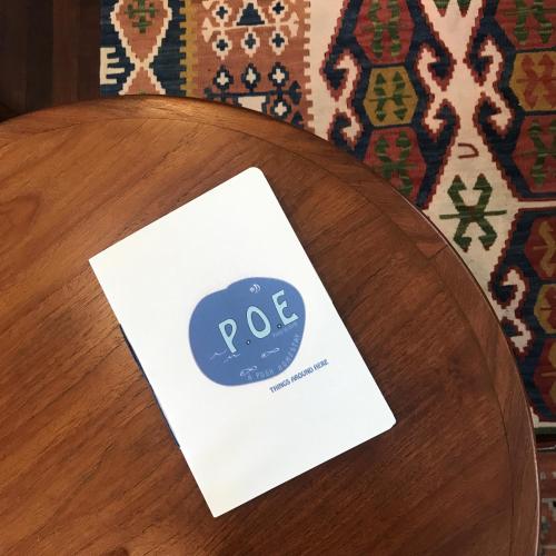 a sign sitting on top of a wooden table at P.O.E Posh Homestay in Cha Am