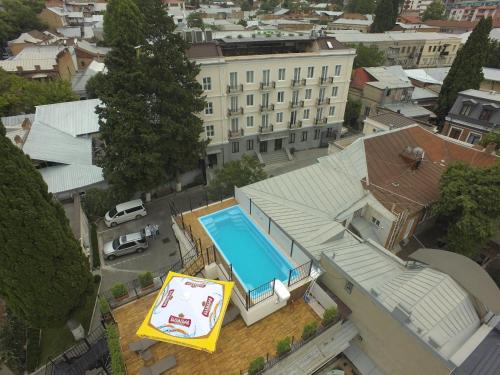 an overhead view of a house with a swimming pool at Hotel ZP Palace in Tbilisi City