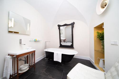 Ett badrum på Apartamentos Habitavit en Cáceres
