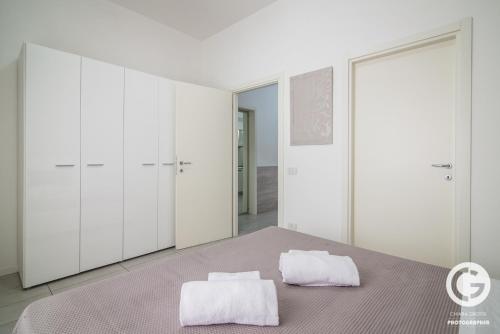 מיטה או מיטות בחדר ב-YPApartments FIERA