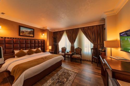 TV o dispositivi per l'intrattenimento presso Town Season Hotel