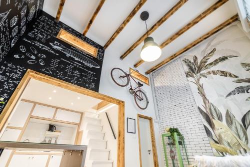 a room with a chalkboard wall and a mirror at Own Budapest at Gozsdu in Budapest