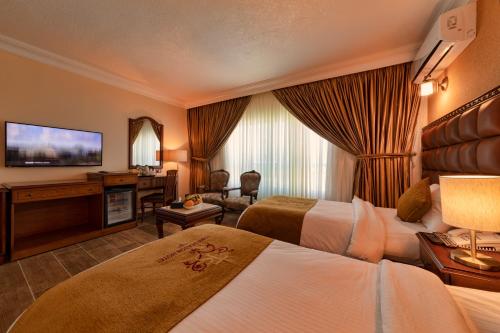 Letto o letti in una camera di Town Season Hotel