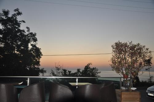 a view of a patio with a table and chairs at Panaroma Damla Otel in Samsun