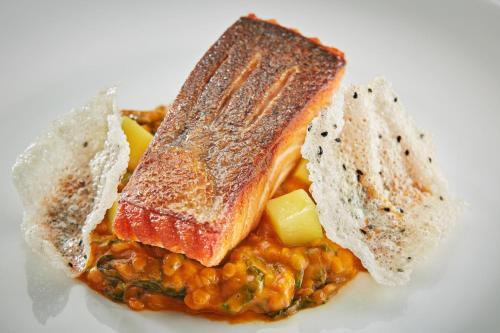 a plate of food with three pieces of bread at Great Fosters - Near Windsor in Egham