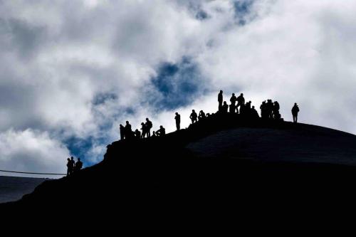 a group of people standing on top of a hill at La Casetta nel cuore del Parco in Locana