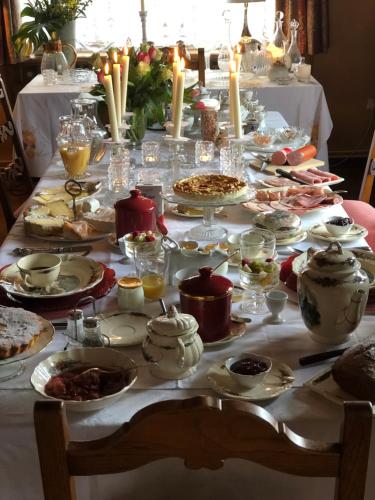 a table with many plates of food on it at La Maison de juliette in Saint-Hippolyte