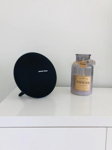 a black ball next to a bottle of perfume at Kasa Imbondeiro in Mindelo