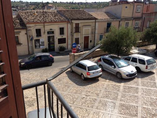 a group of cars parked in a parking lot at La Perla Di Noto in Noto