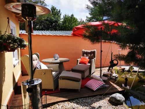 a patio with chairs and a table on a deck at Apartment Apart Waldershof in Waldershof