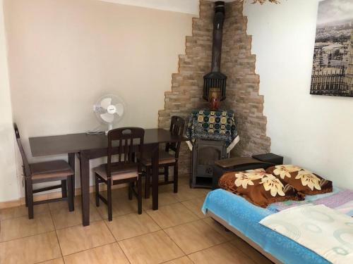 a room with a table and chairs and a dining room at Apartments Dubrava 106 in Dobra Voda