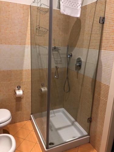 a shower with a glass door in a bathroom at Hotel La Madonnina in Milan