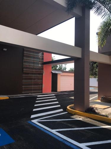 a building with a cross walk on the street at Tropical Inn & Suites, downtown clearwater in Clearwater
