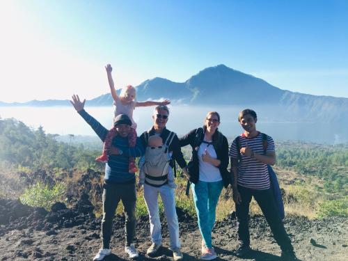 a group of people standing on top of a mountain at Wina Ubud B&B in Ubud