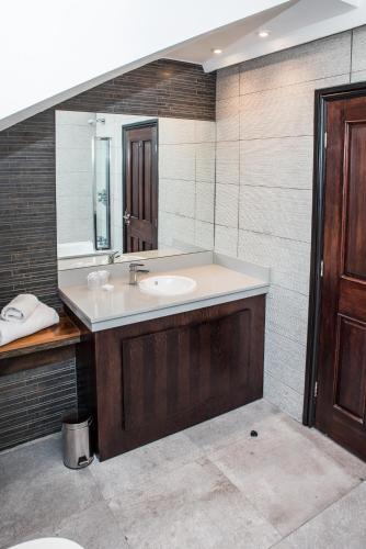 a bathroom with a sink and a mirror at Great Victoria Hotel in Bradford