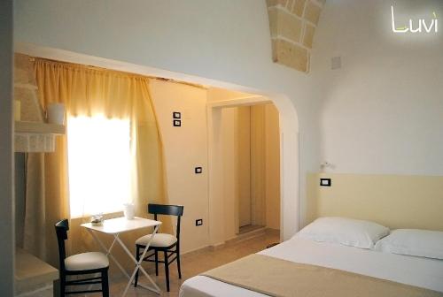 Postel nebo postele na pokoji v ubytování B&B Luvì
