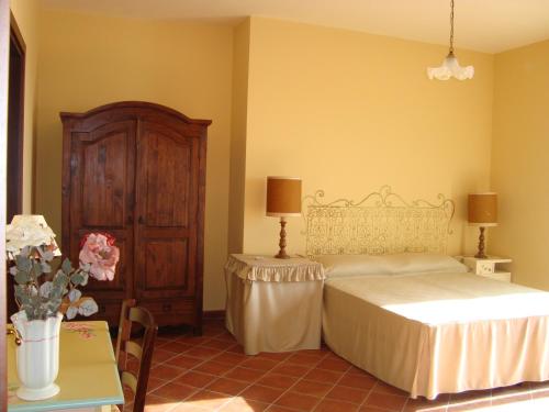 Postel nebo postele na pokoji v ubytování B&B La Rena Rossa