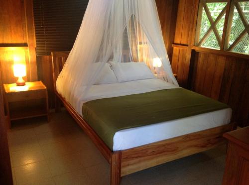 Postel nebo postele na pokoji v ubytování Hotel Utüane