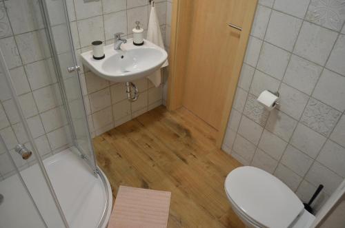 a bathroom with a toilet and a sink at Apartmány Réví in Hlohovec