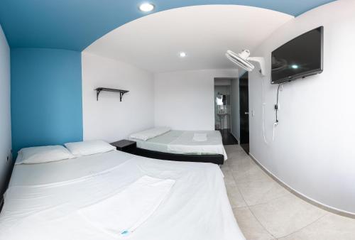 Un ou plusieurs lits dans un hébergement de l'établissement Hotel Oviedo Real