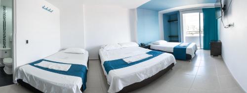 Ein Bett oder Betten in einem Zimmer der Unterkunft Hotel Oviedo Real
