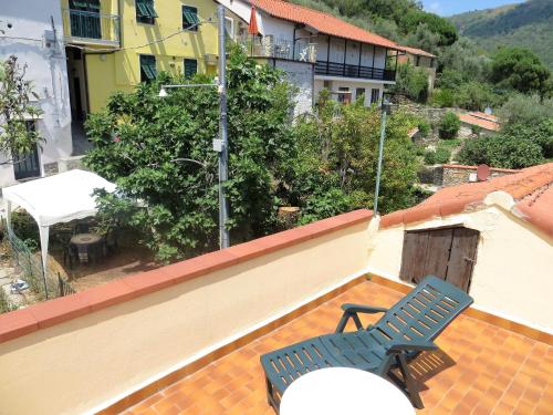 a blue chair sitting on the roof of a building at Casa Tainin in Valloria