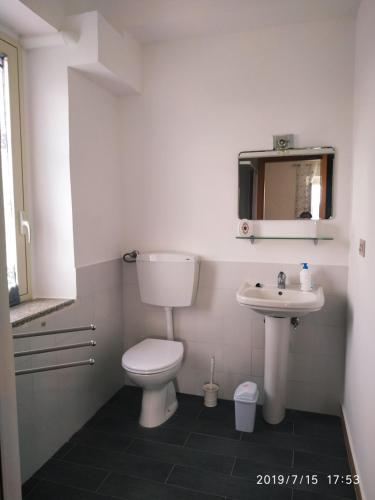 a bathroom with a toilet and a sink at Santa e Maria Affittacamere in Lamezia Terme