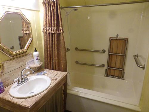 a bathroom with a sink and a shower at Mulberry Lavender Farm and B&B in Mulberry