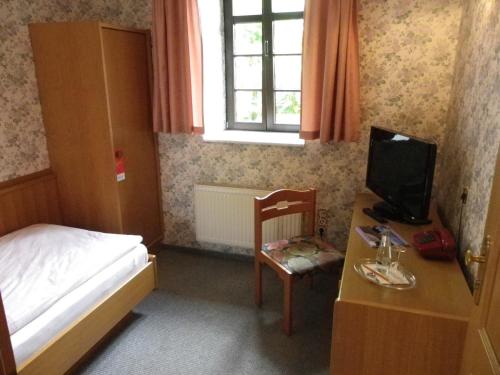 Postel nebo postele na pokoji v ubytování Hotel Wenzels Hof