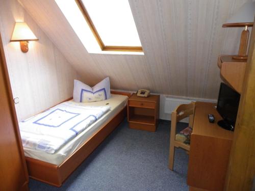 Postel nebo postele na pokoji v ubytování Hotel Wenzels Hof