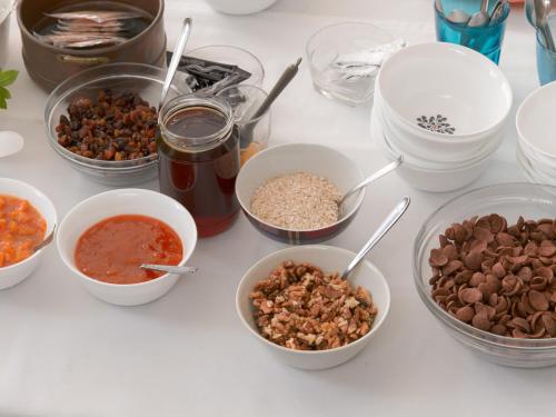 a table topped with bowls of different types of food at Londos Hotel in Piso Livadi