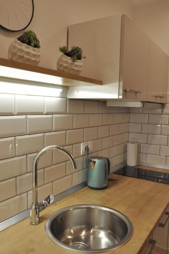 a kitchen counter with a sink in a kitchen at Apartments Via Sole Dramalj in Dramalj